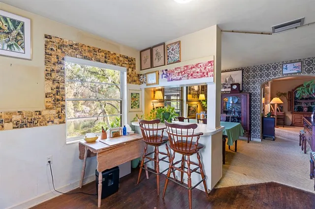 a view of a kitchen with furniture and a window