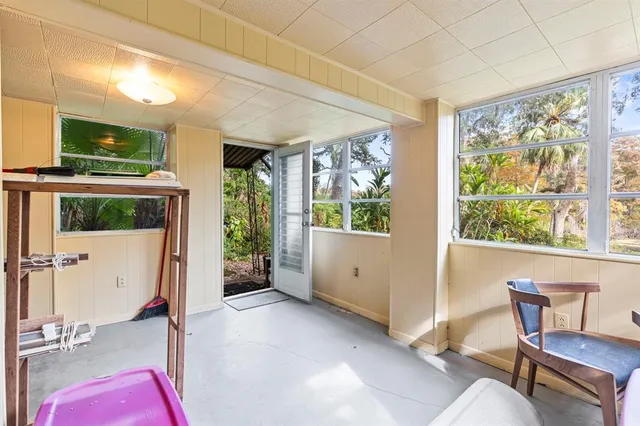 a view of a backyard with sitting area
