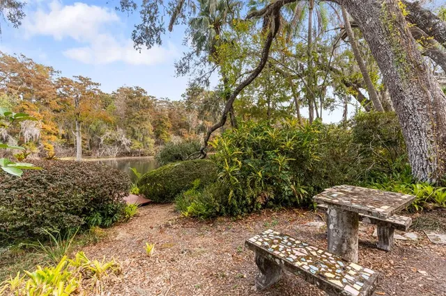 a view of a lake with houses with outdoor space
