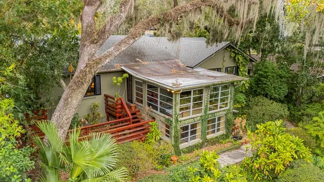 a living room with furniture a lamp and a table