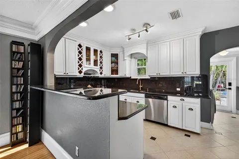 a kitchen with stainless steel appliances granite countertop a stove and a refrigerator