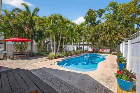 a view of a swimming pool with a patio