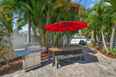 a view of a backyard with sitting area