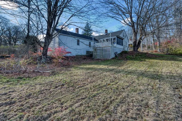 a view of a yard with a tree