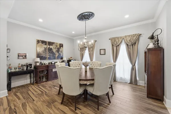 a dining room with furniture window wooden floor