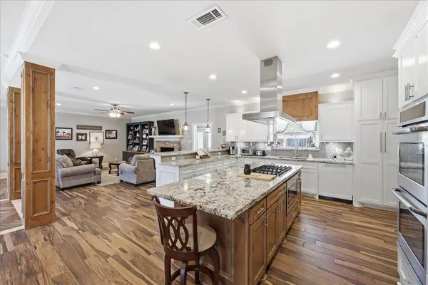 a kitchen with counter top space a sink appliances and cabinets