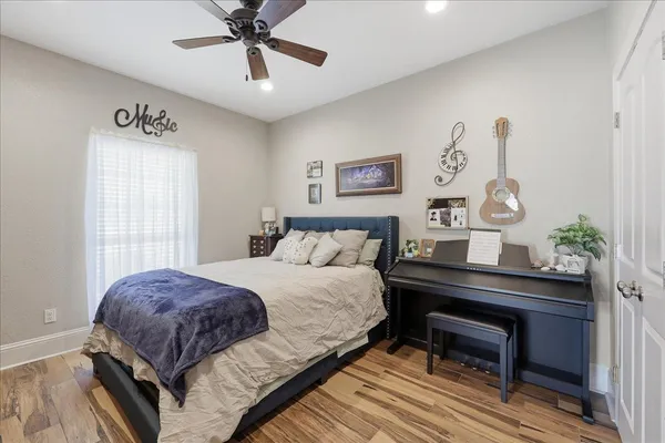 a bedroom with a bed and a table