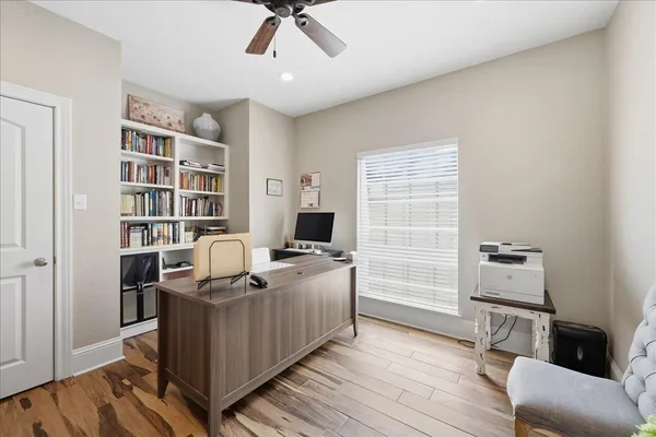 a workspace with furniture and wooden floor