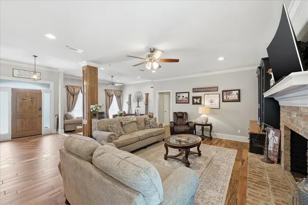 a living room with furniture and a fireplace