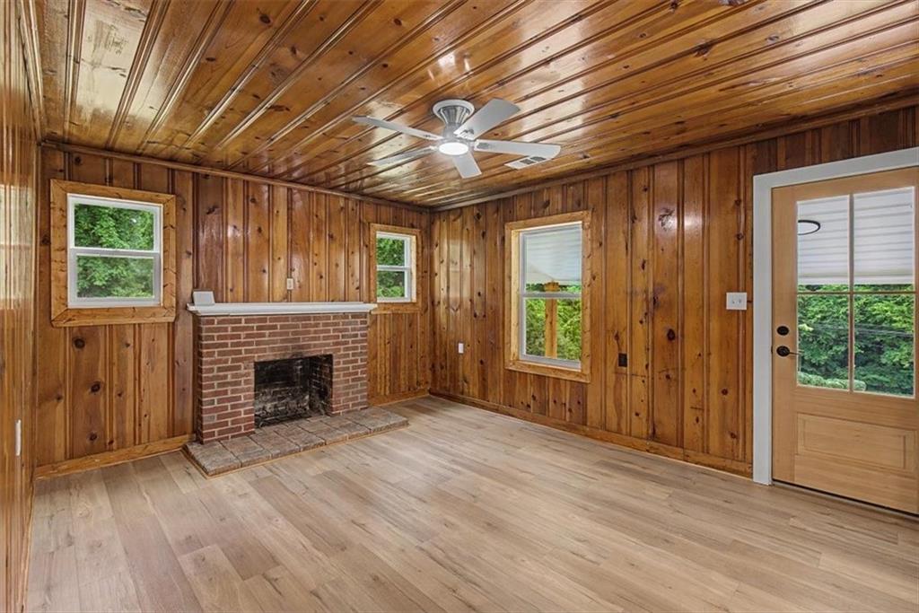 2115 King Road Dalton, GA 30720 - Photo 18 of 54 a view of an empty room with wooden floor fireplace and a window