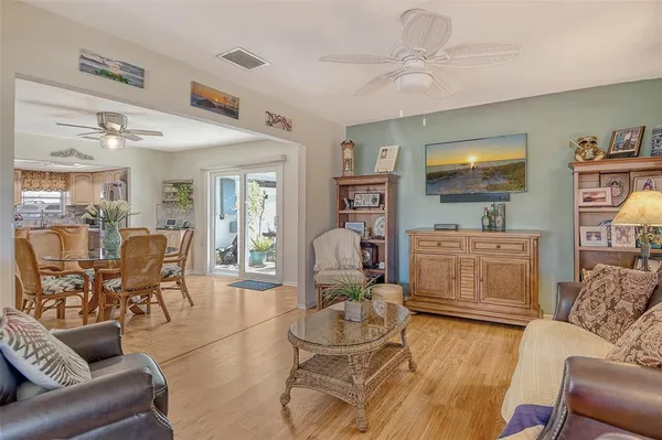 a kitchen with stainless steel appliances granite countertop a sink a stove counter space and a refrigerator