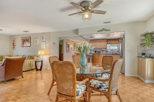 a kitchen with stainless steel appliances granite countertop a stove microwave and refrigerator
