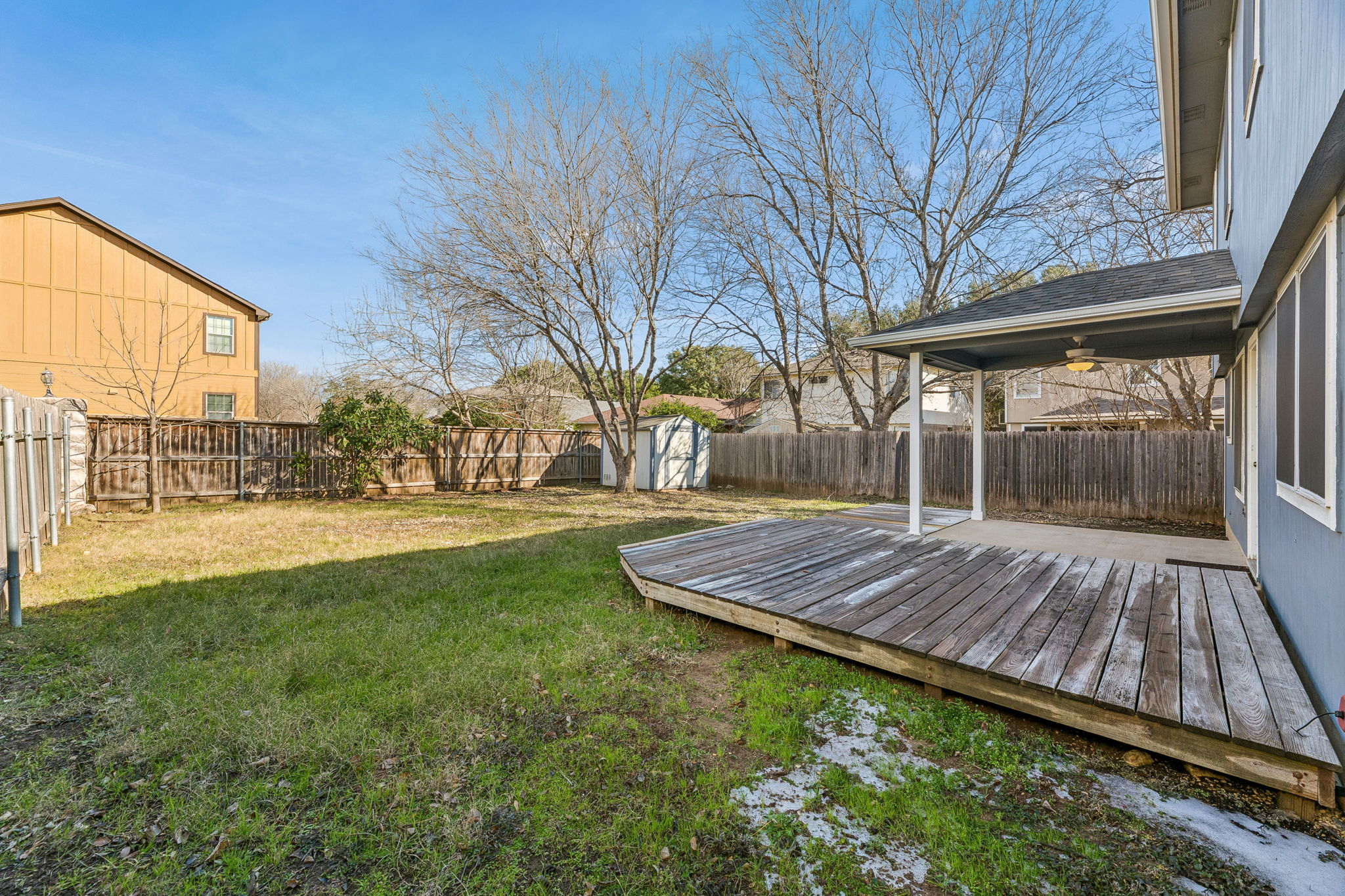 1608 Melibee Trail Austin, TX 78748 - Photo 28 of 29 a view of backyard with a table and chairs and wooden fence