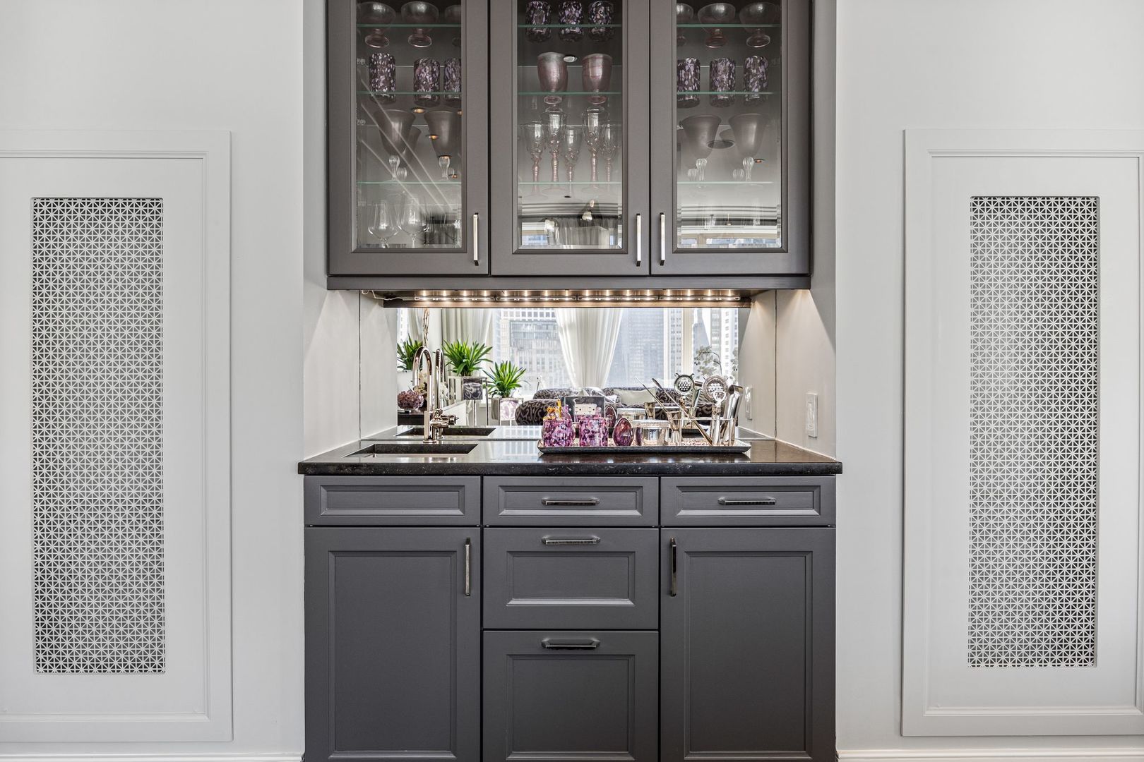 118 East Erie Street, Unit 18A Chicago, IL 60611 - Photo 11 of 40 a kitchen with cabinets and wooden floor