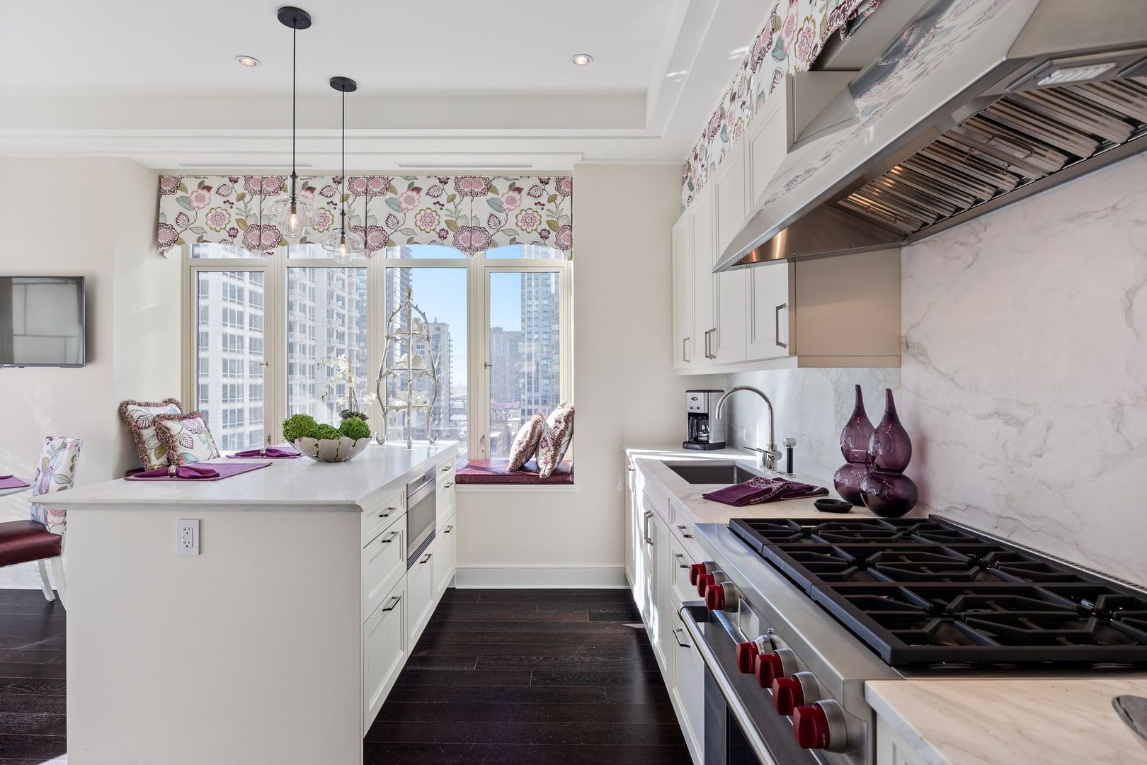 118 East Erie Street, Unit 18A Chicago, IL 60611 - Photo 12 of 40 a kitchen with stainless steel appliances a sink stove and cabinets