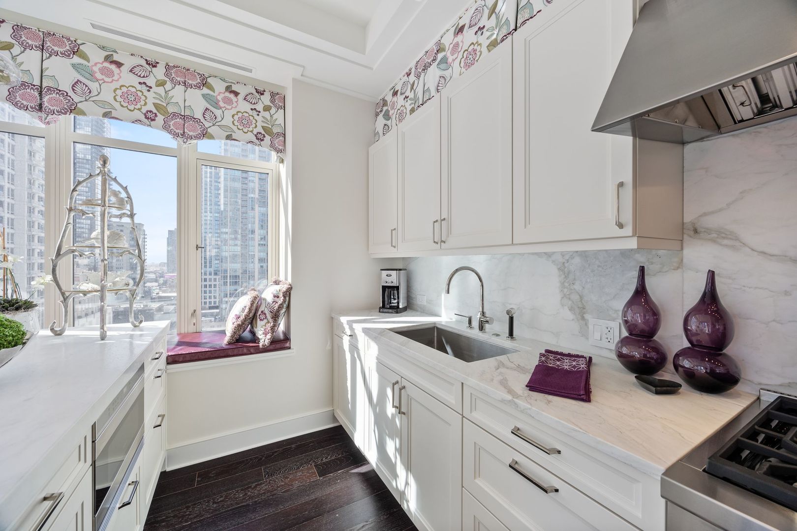 118 East Erie Street, Unit 18A Chicago, IL 60611 - Photo 13 of 40 a kitchen with stainless steel appliances granite countertop a sink stove and cabinets