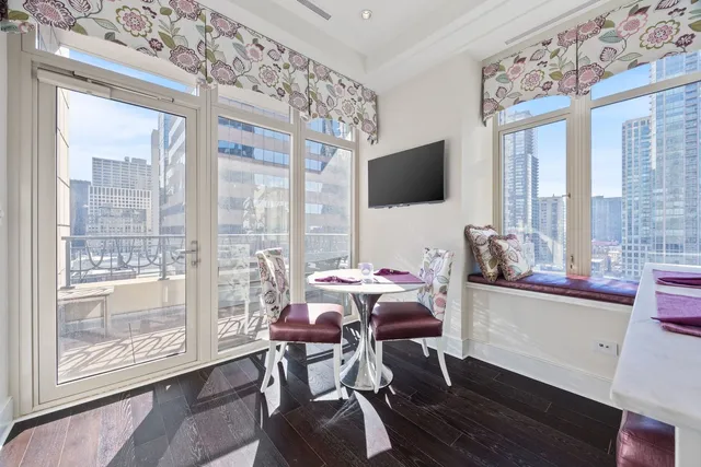 a view of a livingroom with workspace and a window