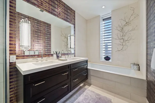 a bathroom with a sink vanity and a mirror