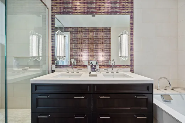 a bathroom with a shower and a sink