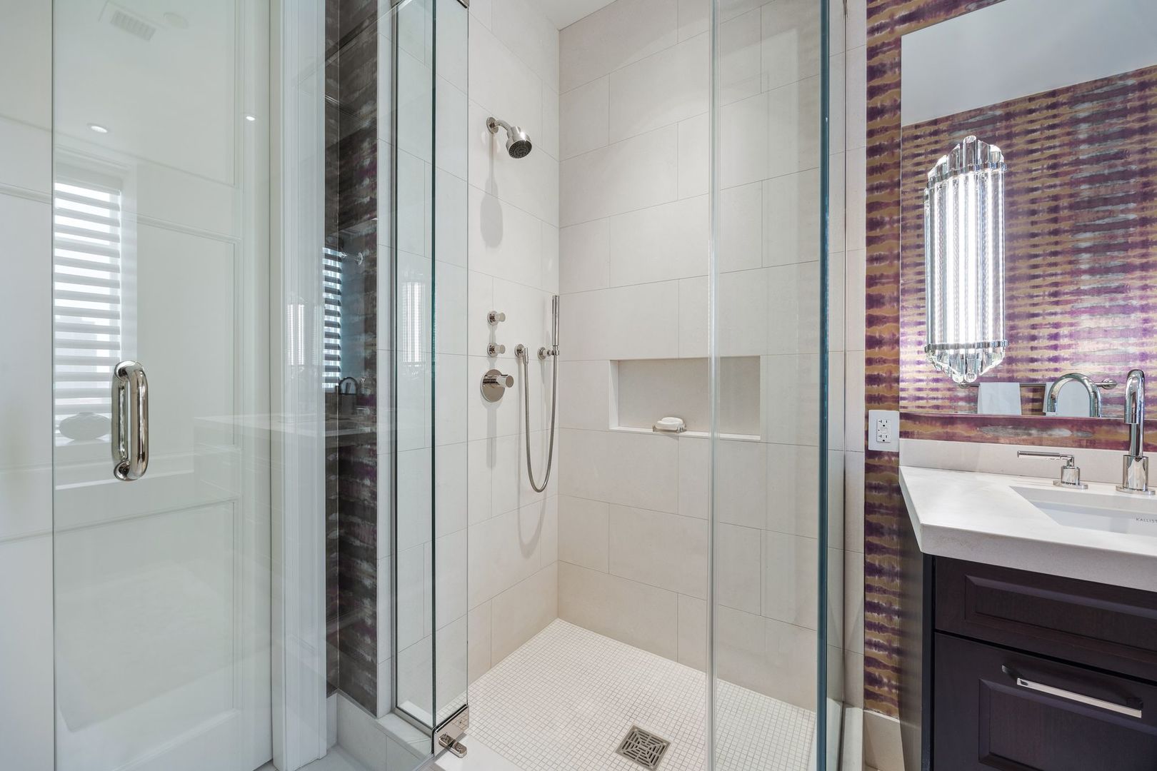 118 East Erie Street, Unit 18A Chicago, IL 60611 - Photo 27 of 40 a bathroom with a shower and a sink