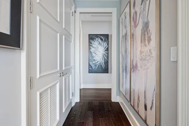 a bedroom with furniture and a large window