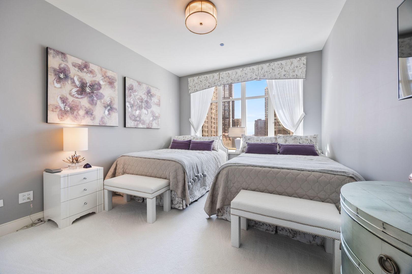 118 East Erie Street, Unit 18A Chicago, IL 60611 - Photo 30 of 40 a bedroom with furniture and a large window