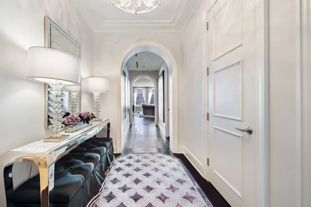 a view of a hallway with a livingroom and a dinning area