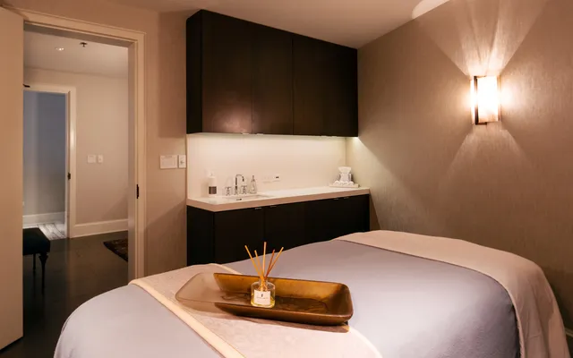 a living room with furniture and a projector screen