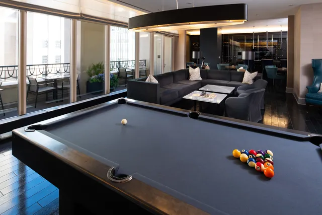 a picture of a bathroom with mirror and tiles
