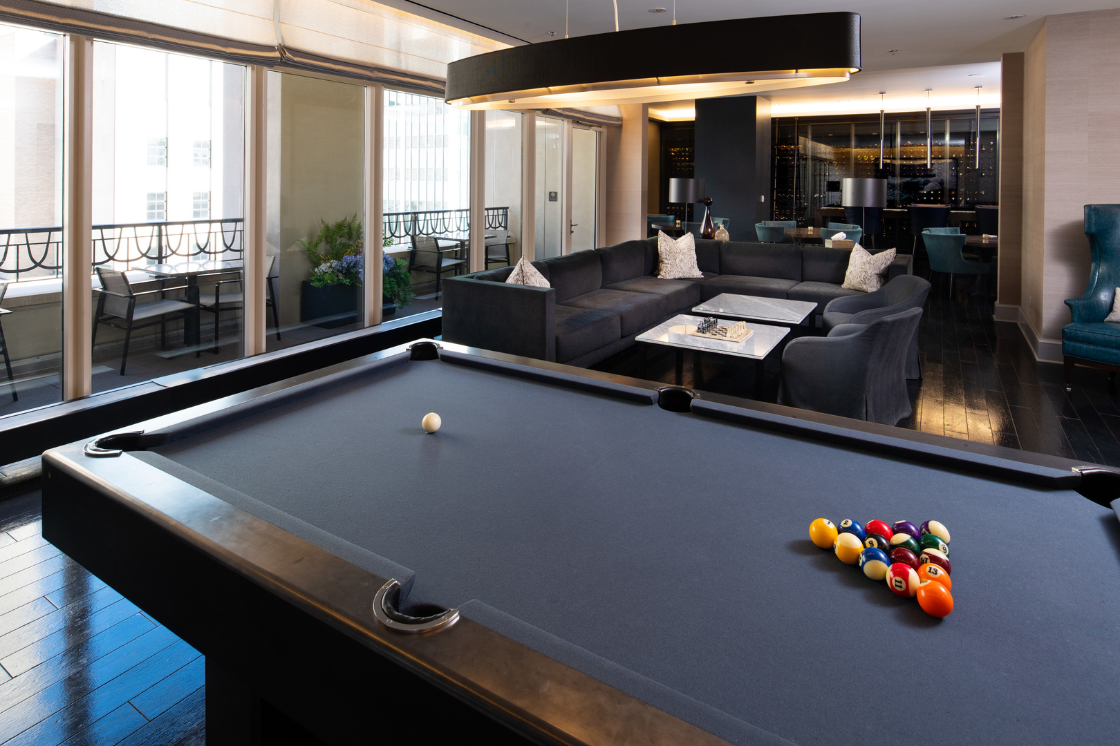 118 East Erie Street, Unit 18A Chicago, IL 60611 - Photo 39 of 40 a room with pool table and glass windows
