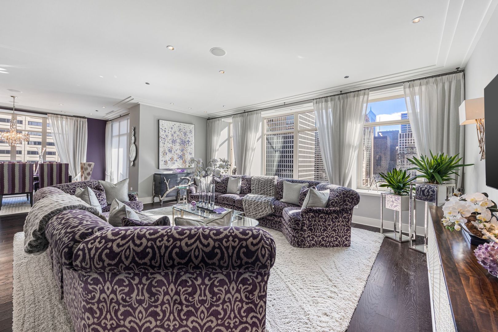 118 East Erie Street, Unit 18A Chicago, IL 60611 - Photo 5 of 40 a living room with furniture potted plant and a large window