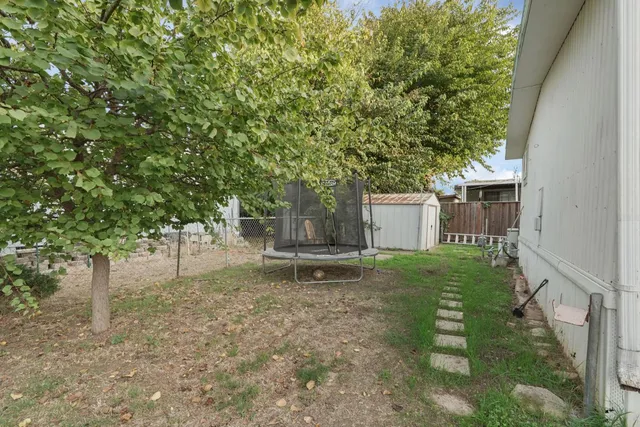 a view of a backyard with sitting area