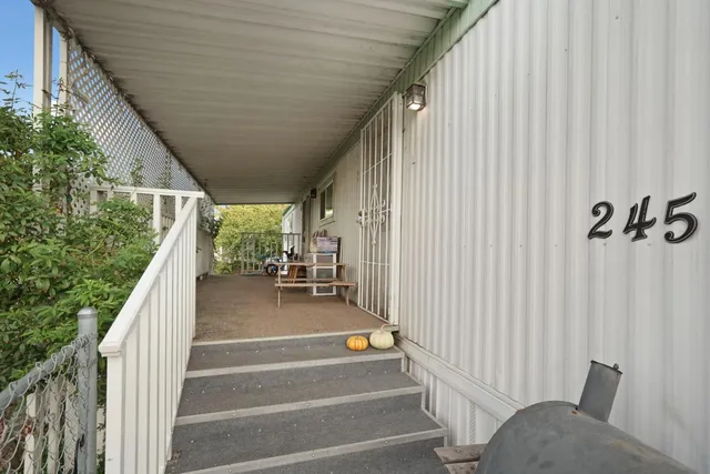 a view of a porch with furniture and front door
