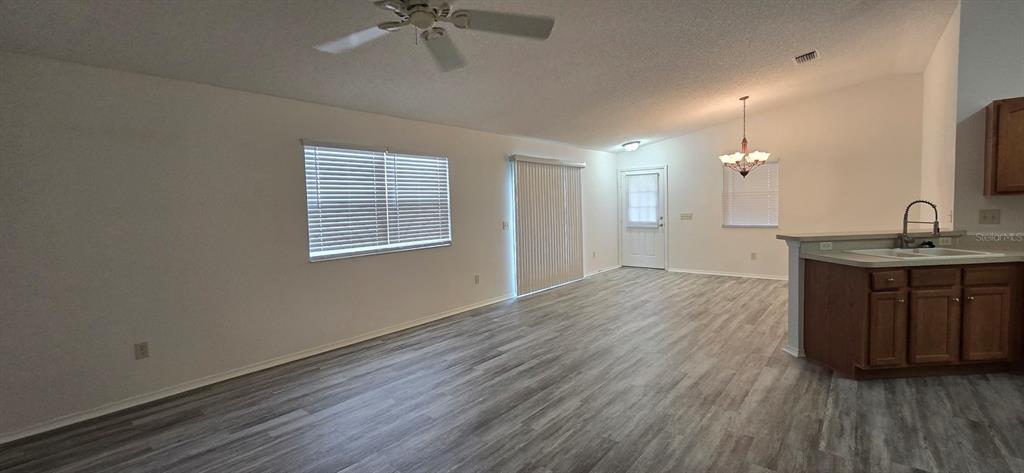 1009 Ridgeville Road The Villages, FL 32162 - Photo 9 of 16 a kitchen with a refrigerator and a sink