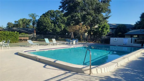a view of a swimming pool with a patio