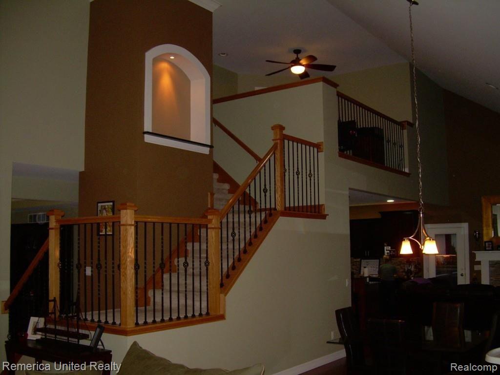 3467 East Commerce Road Commerce Township, MI 48382 - Photo 16 of 36 Stairway from Great Room to Upper Level Loft and Bedrooms.