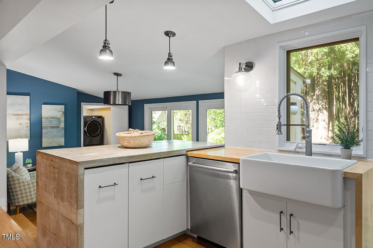 1607 Lorraine Road Raleigh, NC 27607 - Photo 12 of 37 a kitchen with a sink and large window