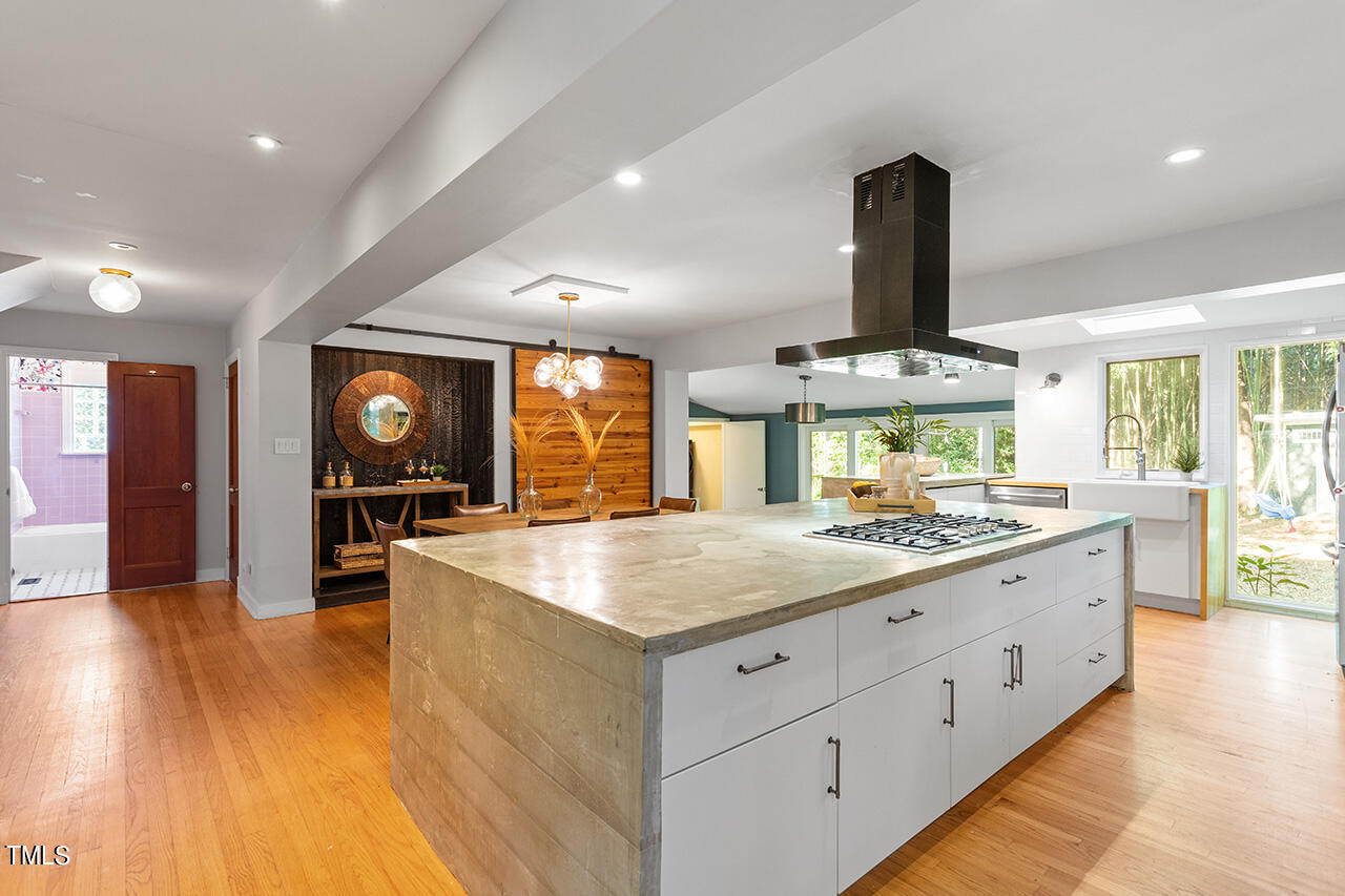 1607 Lorraine Road Raleigh, NC 27607 - Photo 13 of 37 a kitchen with a stove and wooden floor