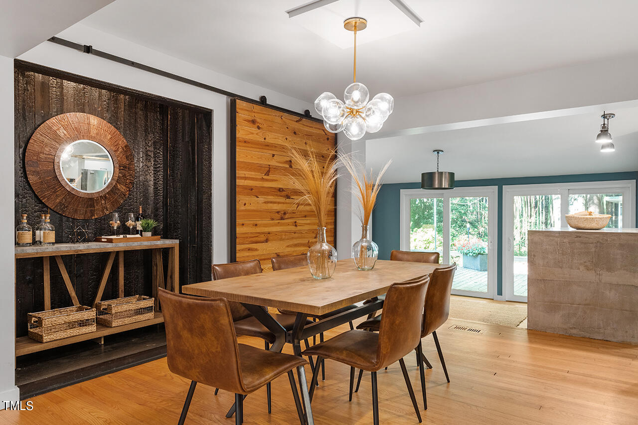 1607 Lorraine Road Raleigh, NC 27607 - Photo 17 of 37 a view of a dining room with furniture window and outside view