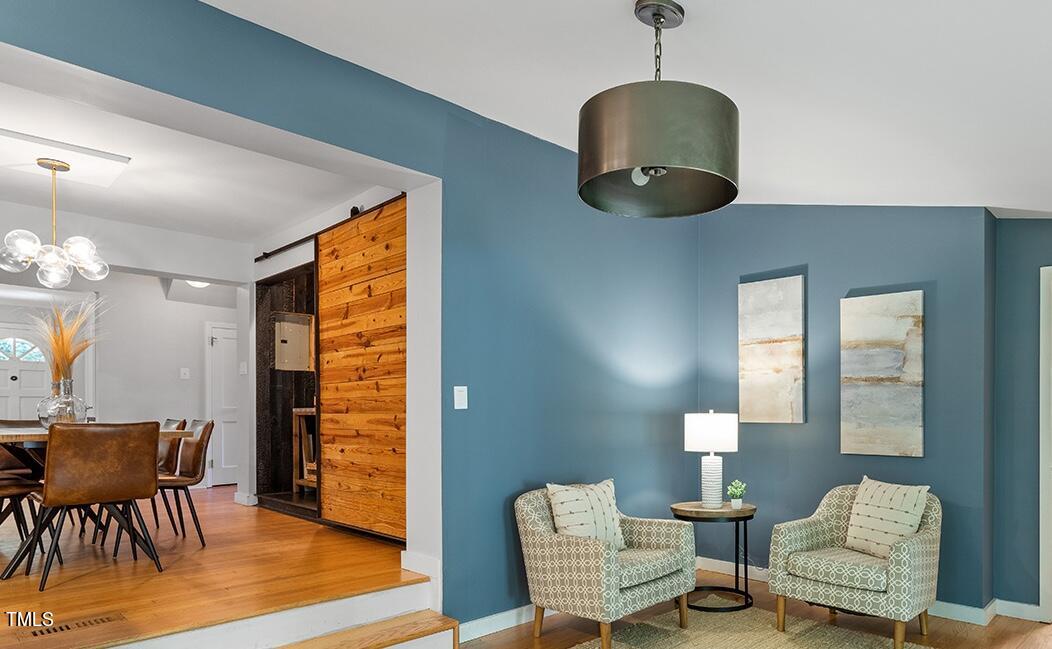 1607 Lorraine Road Raleigh, NC 27607 - Photo 21 of 37 a living room with furniture and a wooden floor
