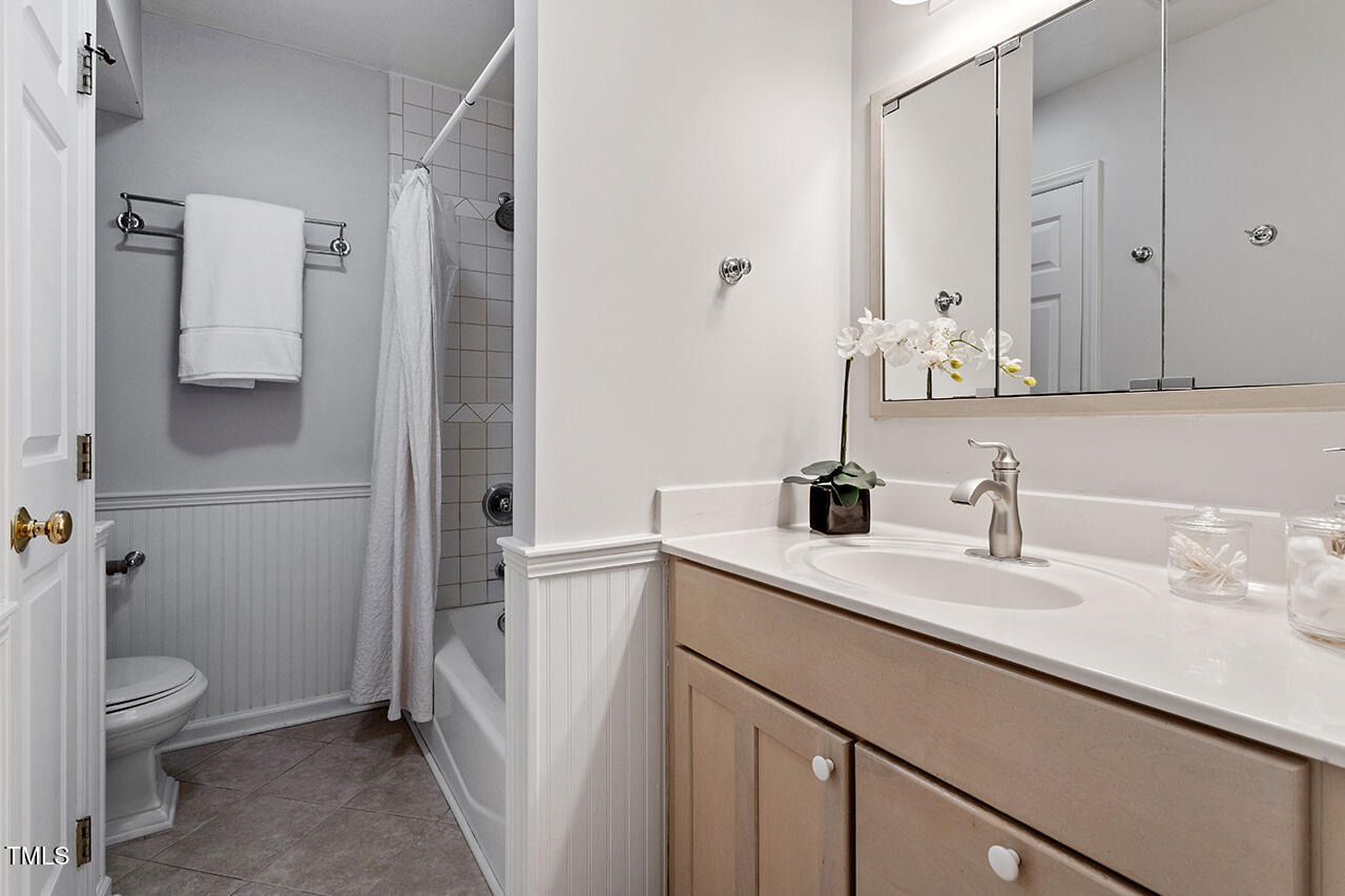 1607 Lorraine Road Raleigh, NC 27607 - Photo 28 of 37 a bathroom with a sink toilet and shower