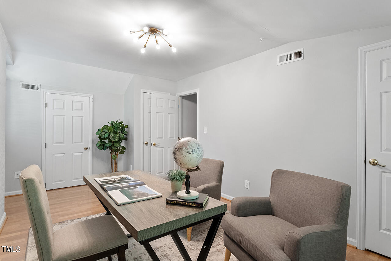 1607 Lorraine Road Raleigh, NC 27607 - Photo 30 of 37 a work room with furniture and a potted plant