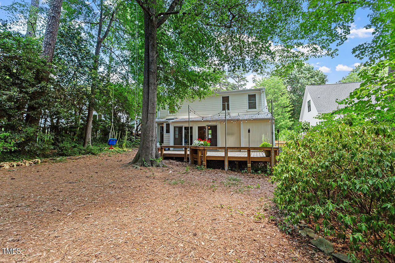 1607 Lorraine Road Raleigh, NC 27607 - Photo 35 of 37 a view of a house with a yard and balcony