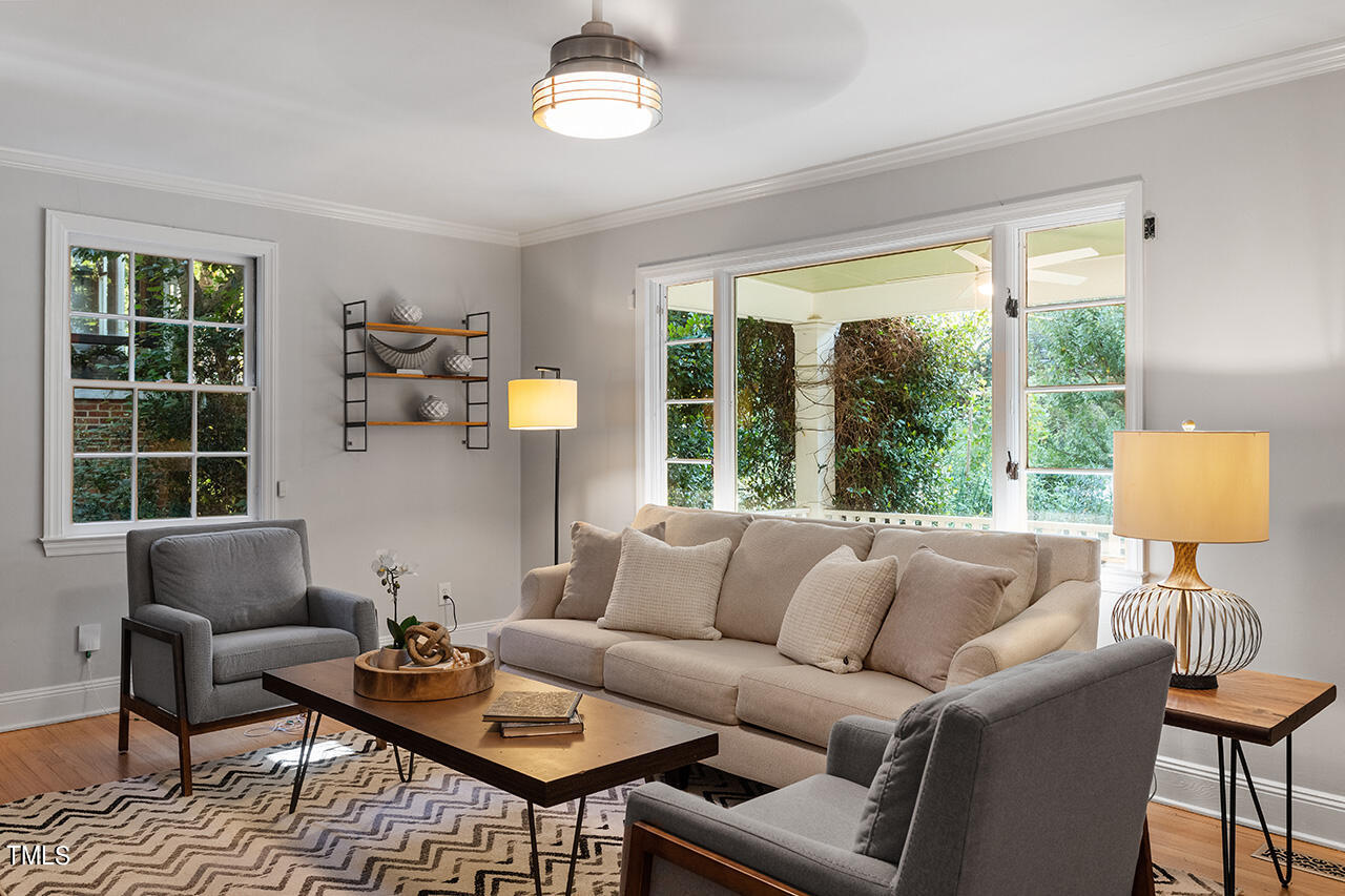 1607 Lorraine Road Raleigh, NC 27607 - Photo 5 of 37 a living room with furniture and a large window