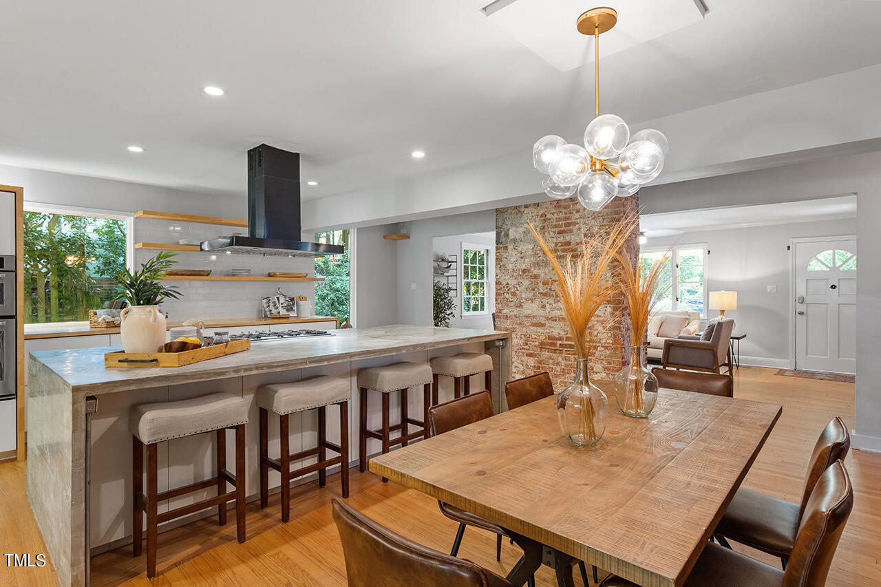 1607 Lorraine Road Raleigh, NC 27607 - Photo 9 of 37 a view of a dining room and a table or chandelier
