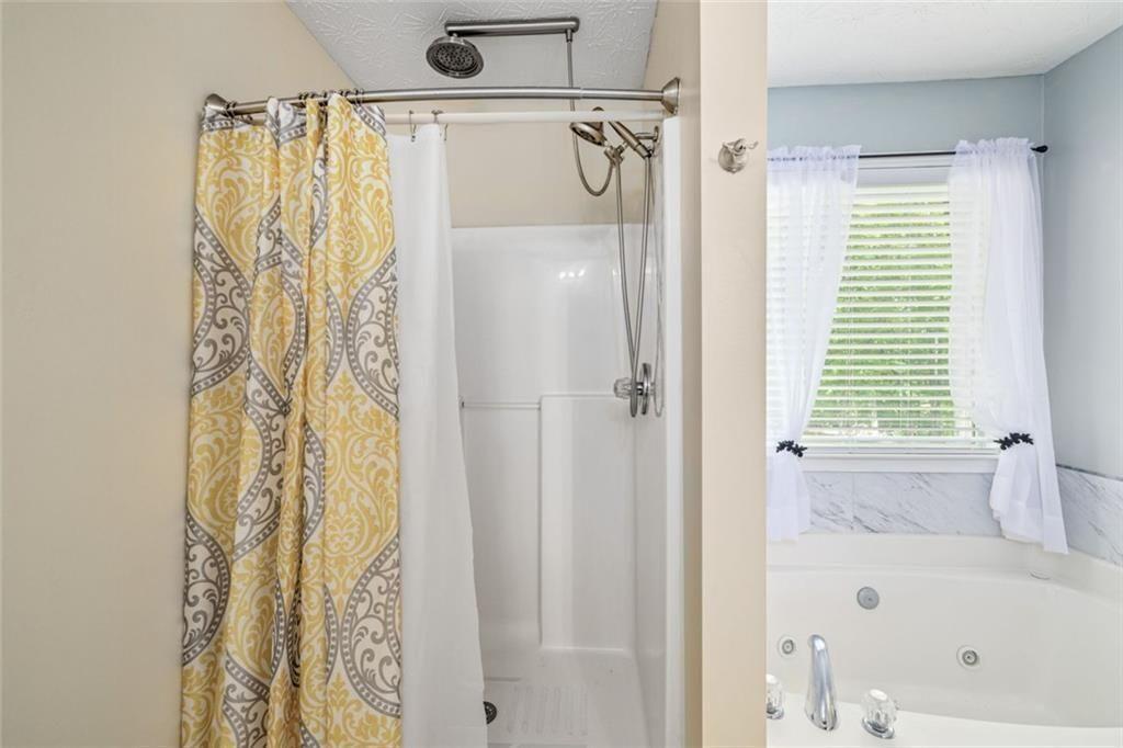 3286 High View Court Gainesville, GA 30506 - Photo 26 of 38 a bathroom with a bathtub and a shower