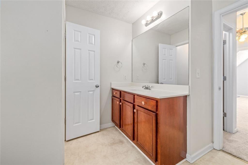 3286 High View Court Gainesville, GA 30506 - Photo 28 of 38 a bathroom with mirror sink and vanity