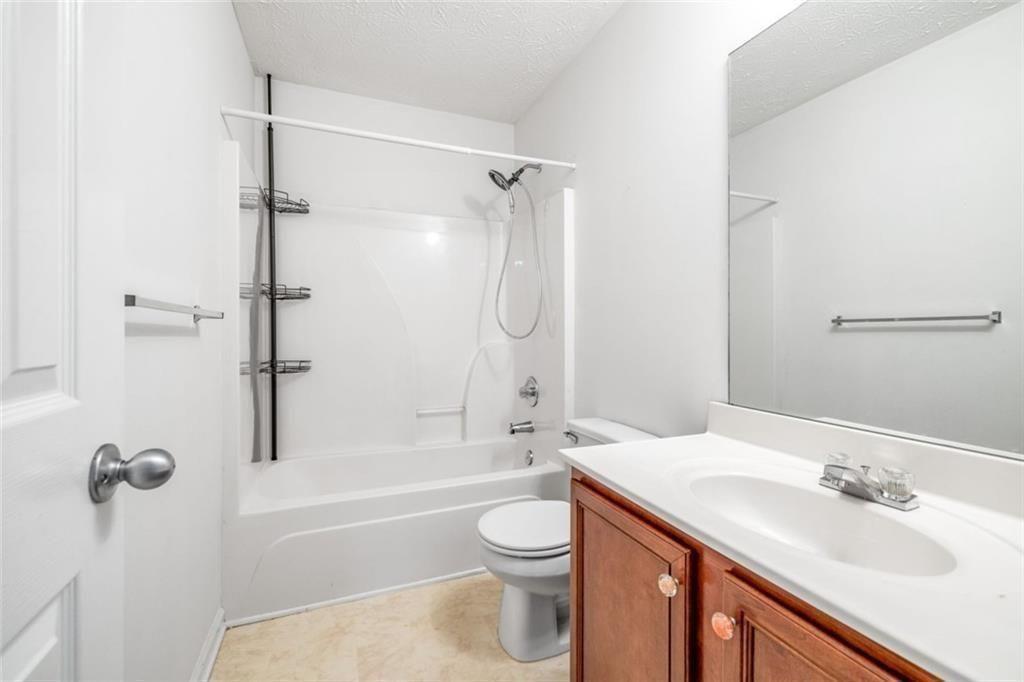 3286 High View Court Gainesville, GA 30506 - Photo 36 of 38 a bathroom with a sink a toilet and shower
