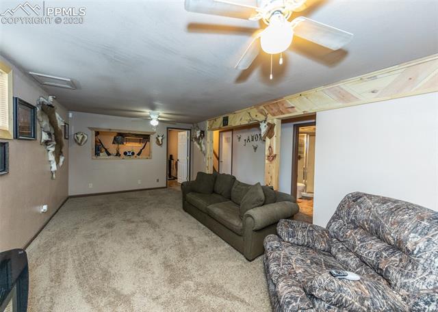 6727 Seneca Road Colorado Springs, CO 80915 - Photo 28 of 50 Office/other room cut out overlooks family room.