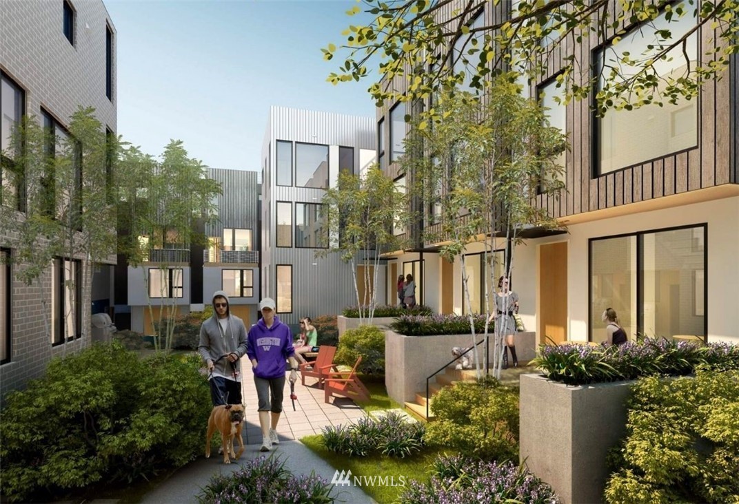 63 East Lynn Street Seattle, WA 98102 - Photo 15 of 20 a front view of a house with patio furniture and flowers